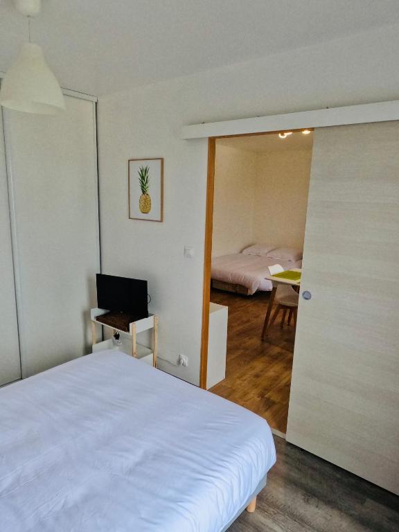 Posteľ alebo postele v izbe v ubytovaní Appartement Cosy Joué-Les-Tours