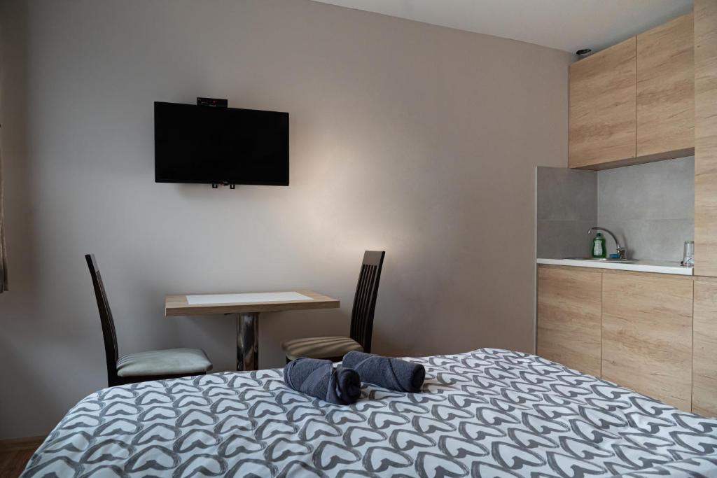 Postel nebo postele na pokoji v ubytování Studio Apartments Maksimović