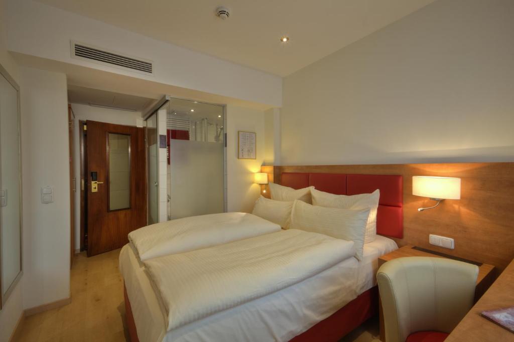 Postel nebo postele na pokoji v ubytování Hotel Condor