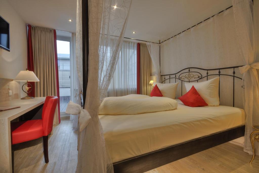 Postel nebo postele na pokoji v ubytování Hotel Condor