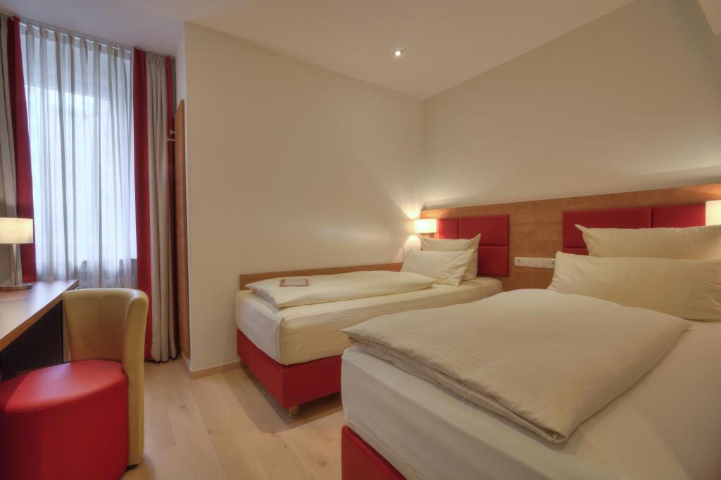 Postel nebo postele na pokoji v ubytování Hotel Condor