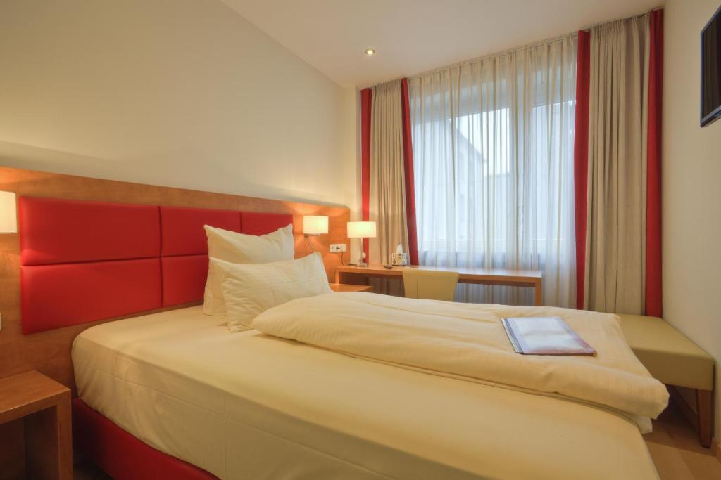 Postel nebo postele na pokoji v ubytování Hotel Condor