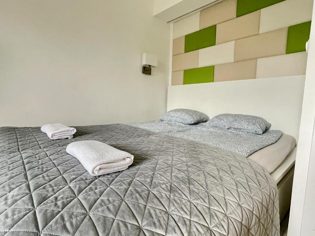 Posteľ alebo postele v izbe v ubytovaní Bonita Apartman & Garage
