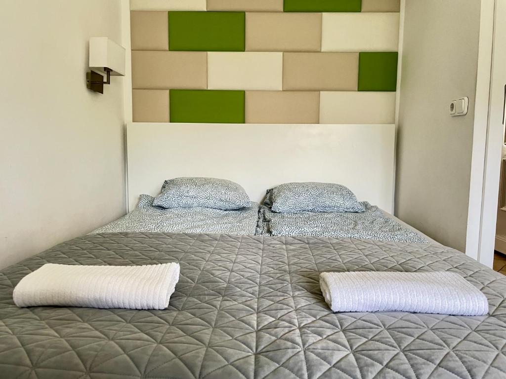 Posteľ alebo postele v izbe v ubytovaní Bonita Apartman & Garage