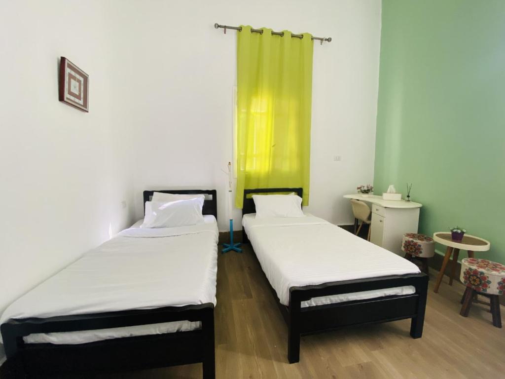 Postel nebo postele na pokoji v ubytování City Hostel Dormitory