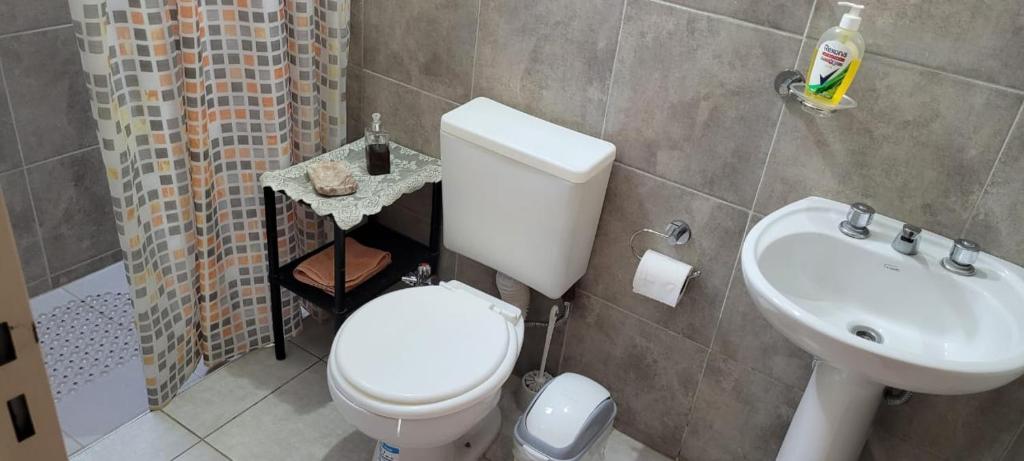 a bathroom with a white toilet and a sink at Chayerita - Suite en La Rioja in La Rioja