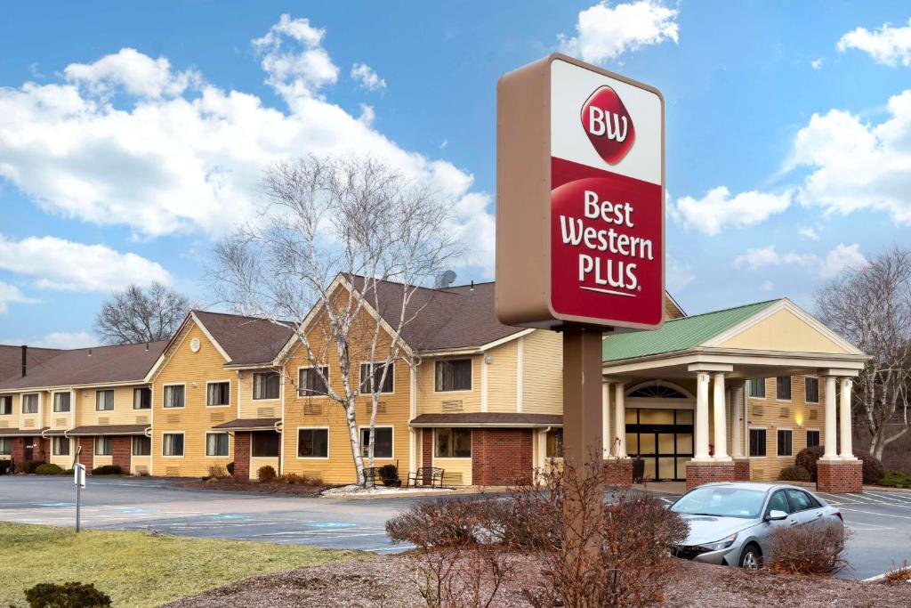 a best western plus sign in front of a hotel at Best Western Plus The Inn at Sharon/Foxboro in Sharon