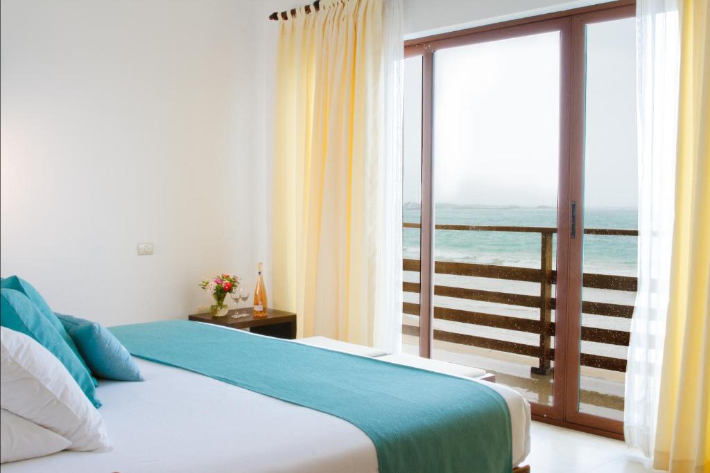 Postel nebo postele na pokoji v ubytování Cormorant Beach House