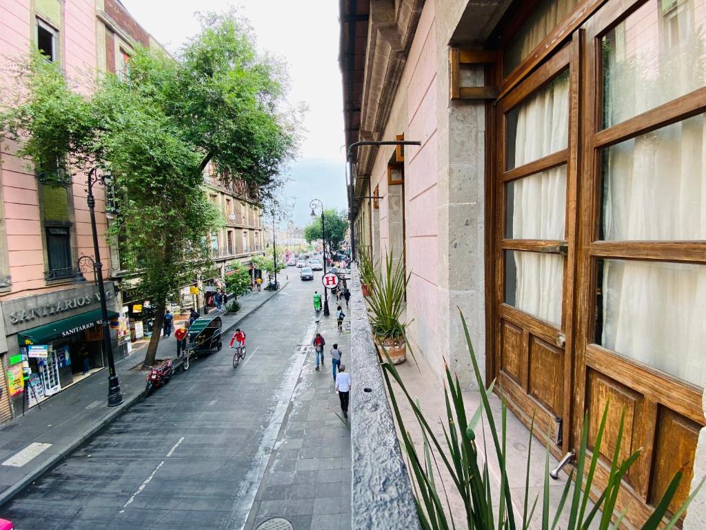 a view of a street with people walking down the street at WHOST Hotel y Hostal in Mexico City