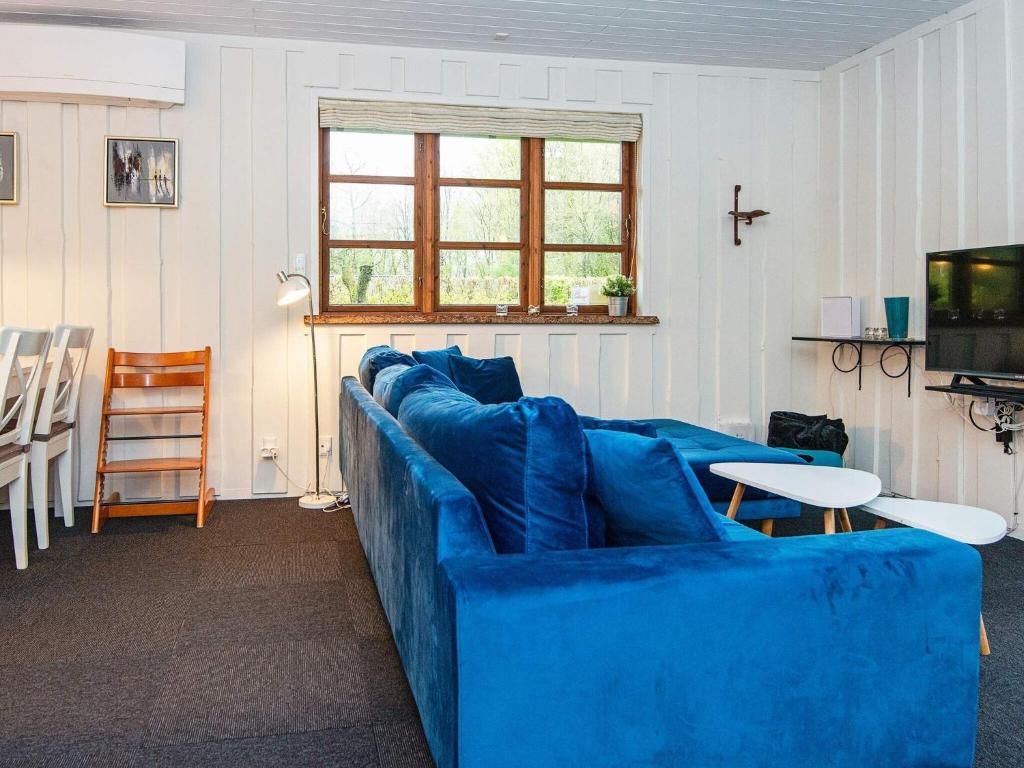 Televiisor ja/või meelelahutuskeskus majutusasutuses Holiday home Toftlund XLIX
