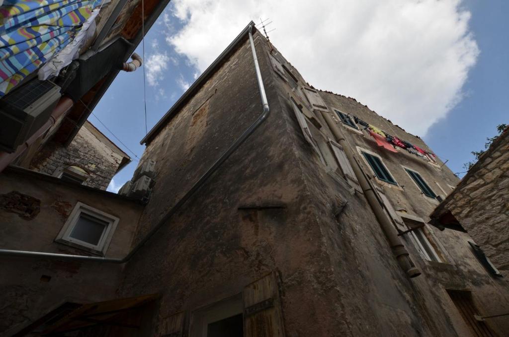 an old building with a tower on top of it at Apartments and rooms with WiFi Rovinj - 20857 in Rovinj