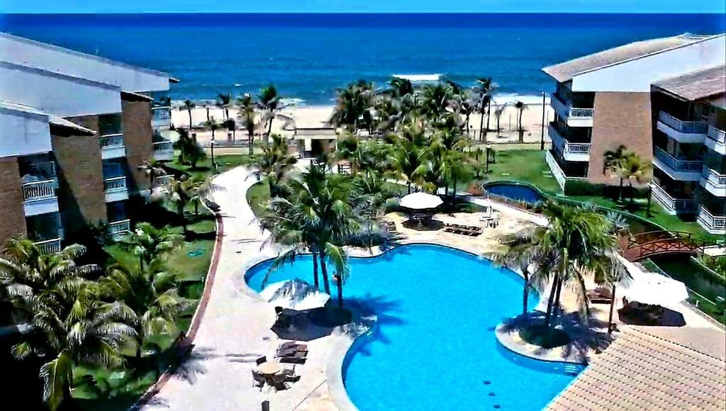 Bazén v ubytování Paraíso das Dunas - Apartamento à beira mar com jacuzzi - Próximo ao Beach Park nebo v jeho okolí