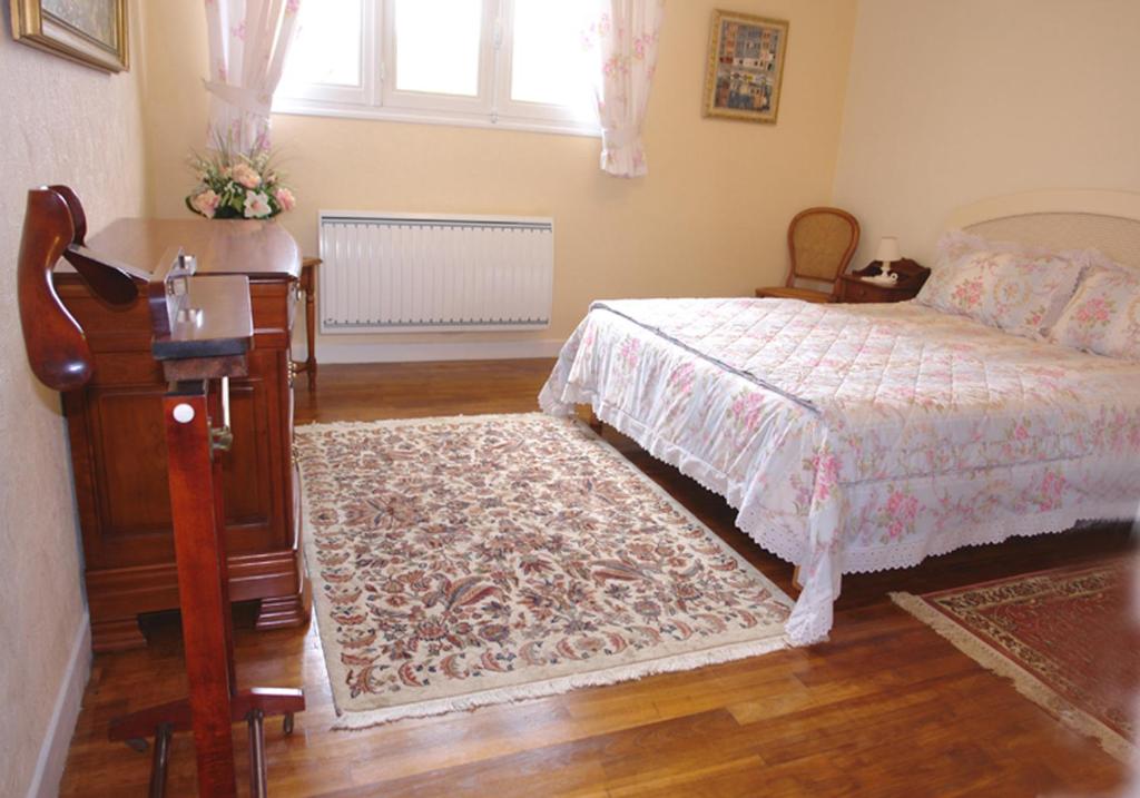 Postel nebo postele na pokoji v ubytování Les Etangs de Pitié