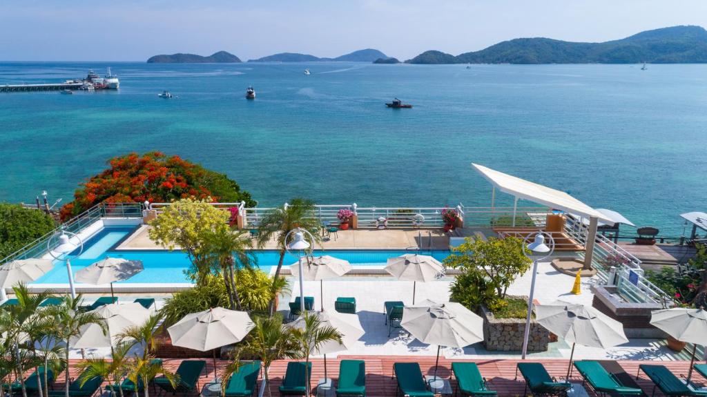 a resort swimming pool with a view of the water at Kantary Bay Hotel Phuket in Panwa Beach