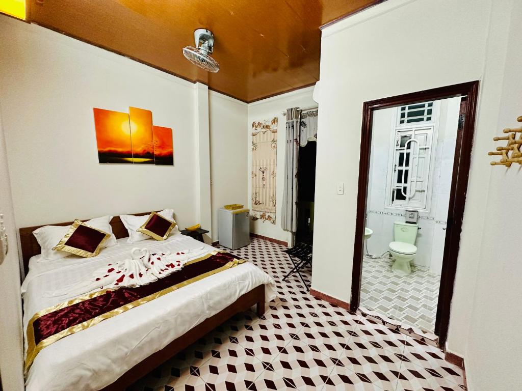 Postel nebo postele na pokoji v ubytování DK House Homestay