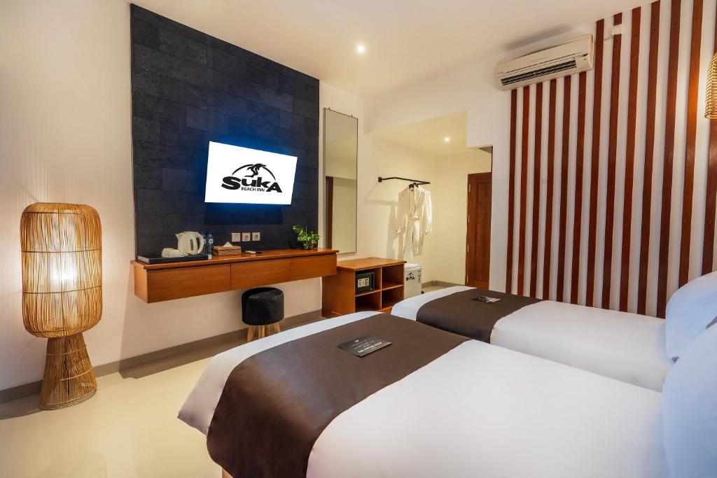 Katil atau katil-katil dalam bilik di Suka Beach Inn