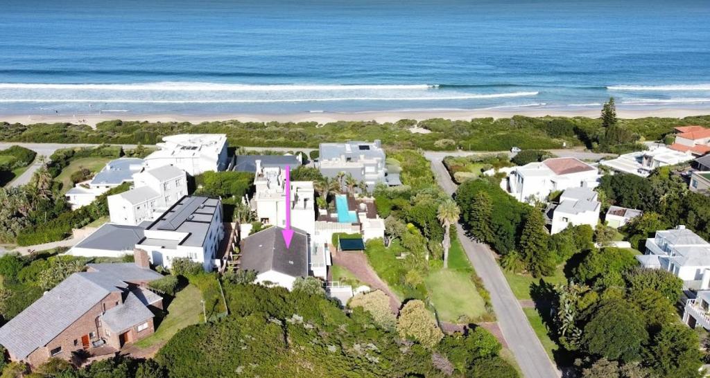 an aerial view of a house on the beach at Villa Azure - Sea Views, Pool - 70m onto Robberg 5 Beach in Plettenberg Bay