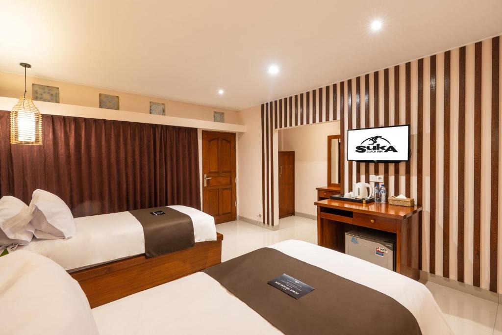 Katil atau katil-katil dalam bilik di Suka Beach Inn