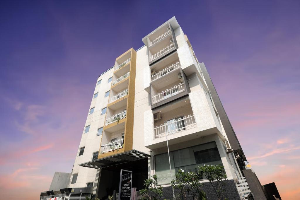 a white building with balconies on the side of it at Royale Sapphire Suites Whitefield Main Rd, KR Puram in Bangalore