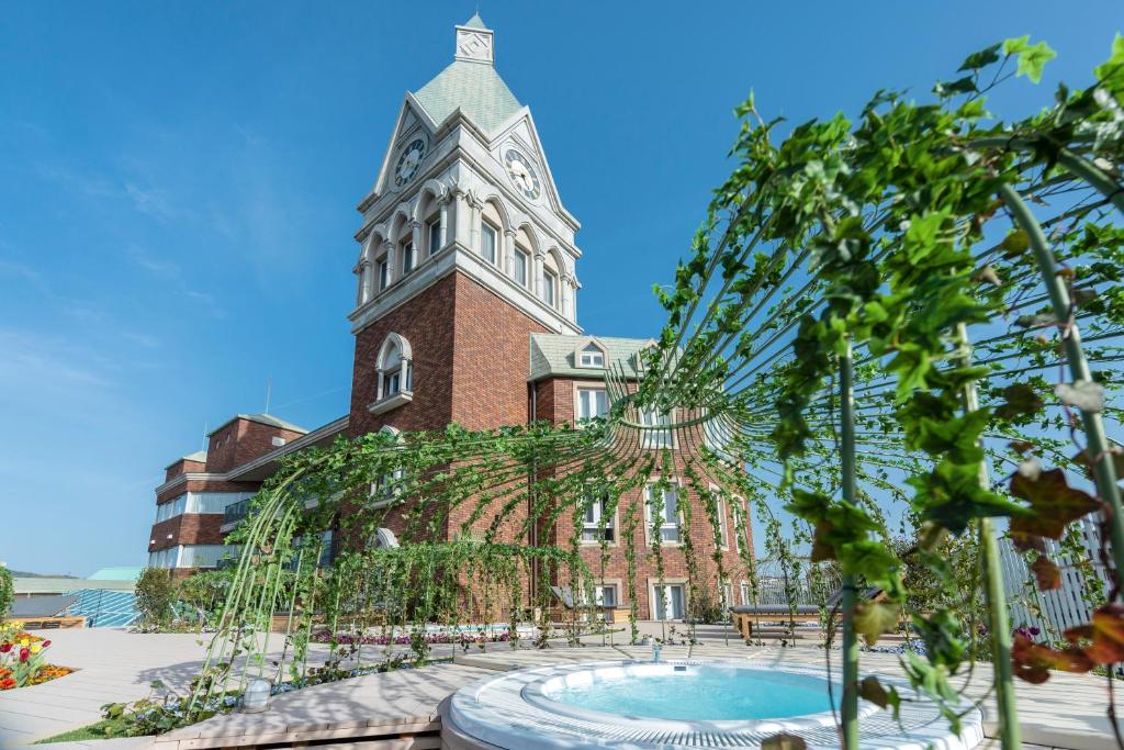 a building with a clock tower on top of it at ROYAL CHESTER NAGASAKI hotel&retreat in Nagasaki