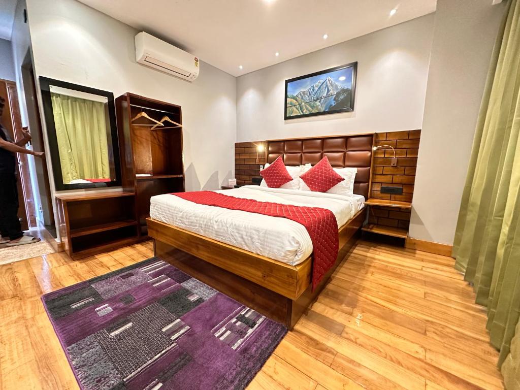 Postel nebo postele na pokoji v ubytování NUMINOUS HOTEL