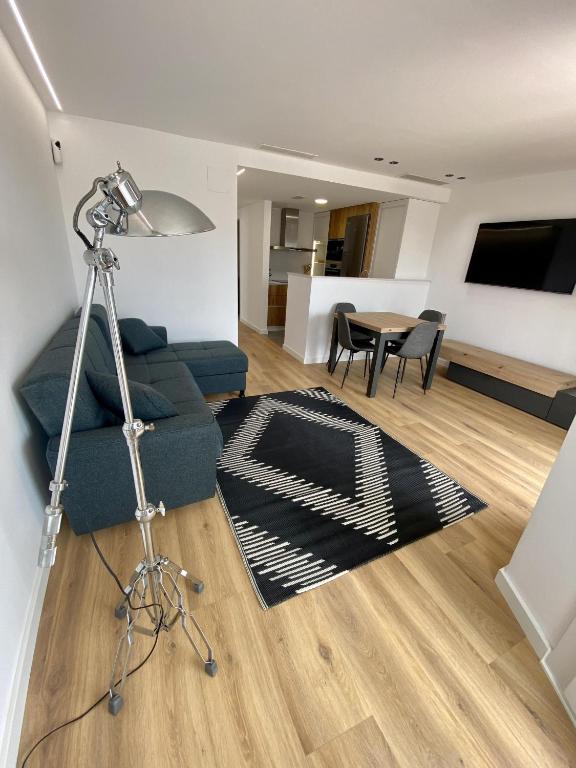 Televízia a/alebo spoločenská miestnosť v ubytovaní For a Stay Regueral Mar