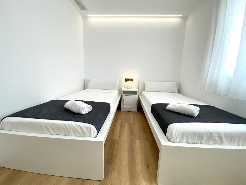 Posteľ alebo postele v izbe v ubytovaní For a Stay Regueral Mar