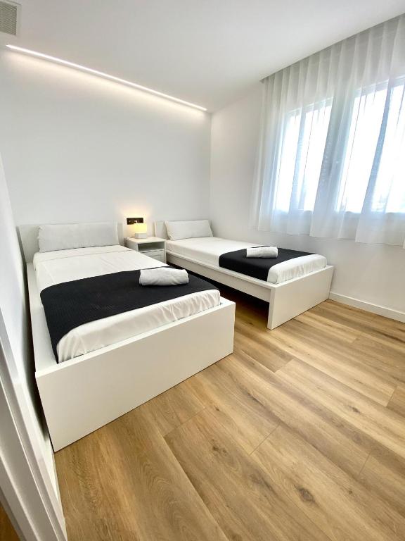 Posteľ alebo postele v izbe v ubytovaní For a Stay Regueral Mar