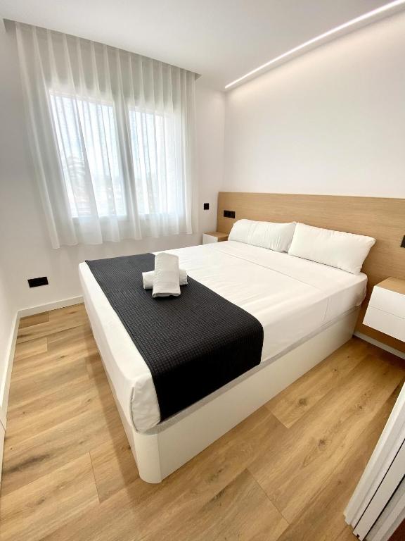 Posteľ alebo postele v izbe v ubytovaní For a Stay Regueral Mar