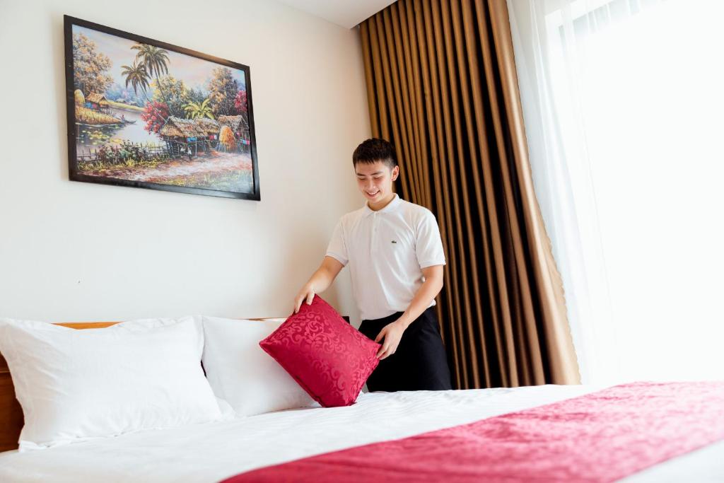 Postel nebo postele na pokoji v ubytování Vĩnh Sơn Nội Bài