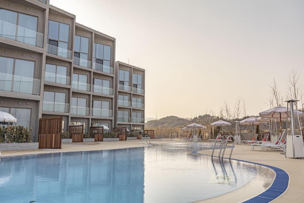 a swimming pool in front of a building at Corallo By Josun in Yangyang