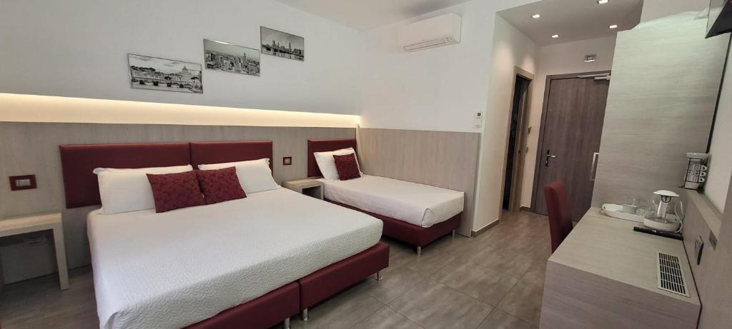 Postel nebo postele na pokoji v ubytování Eden Rooms
