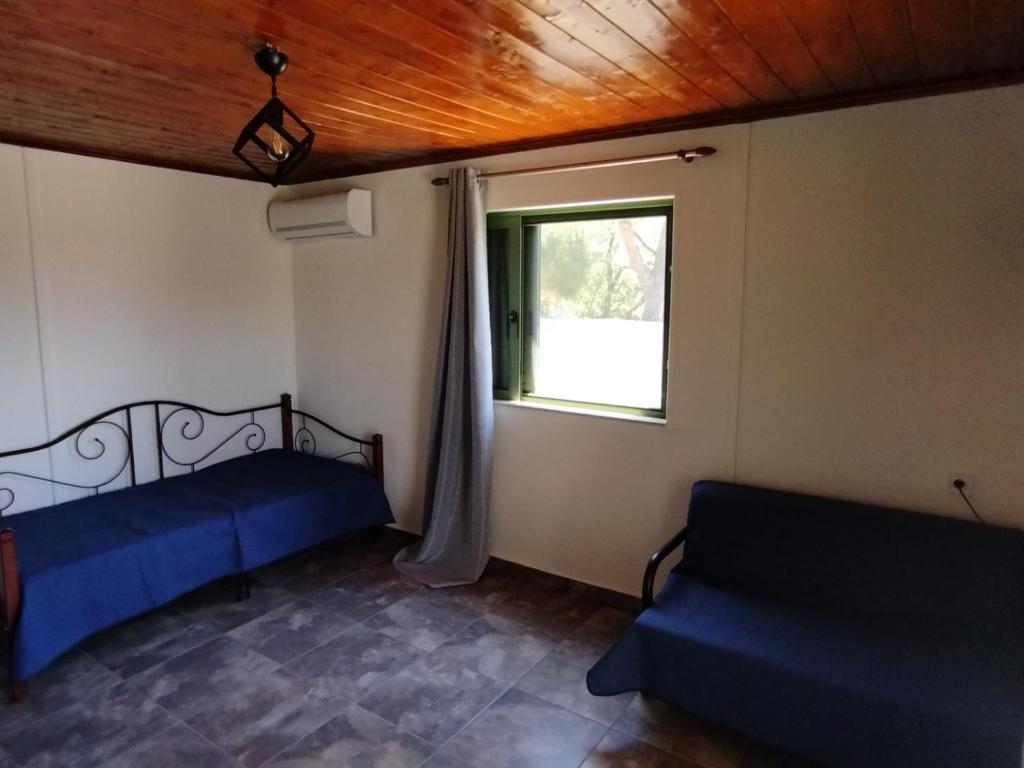 Postel nebo postele na pokoji v ubytování Cosmitsa House