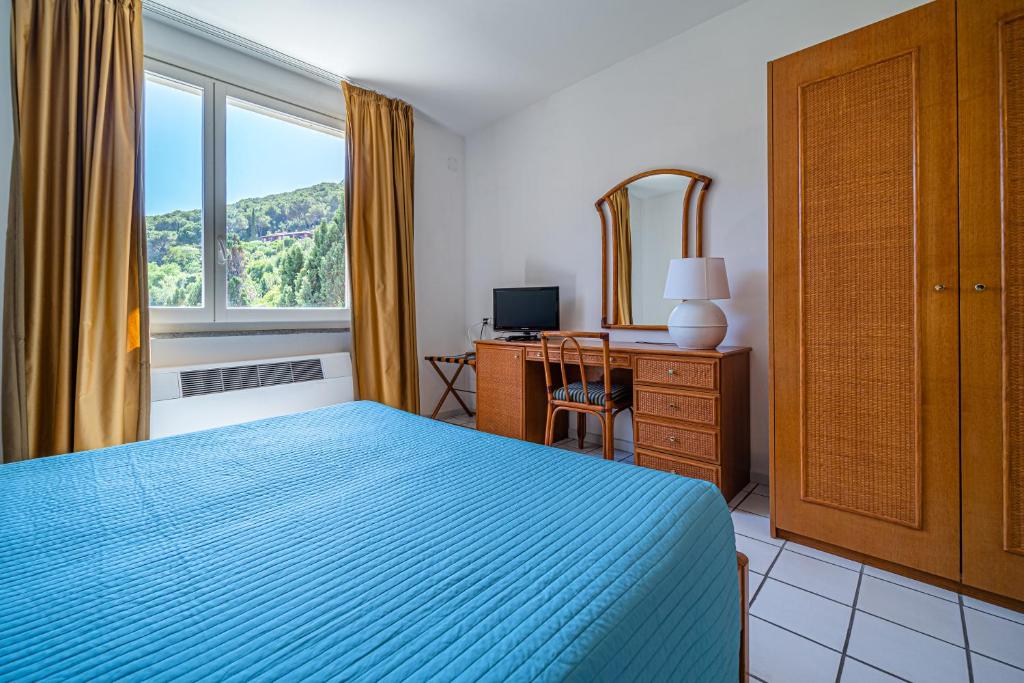 Postel nebo postele na pokoji v ubytování Hotel Yacht Club