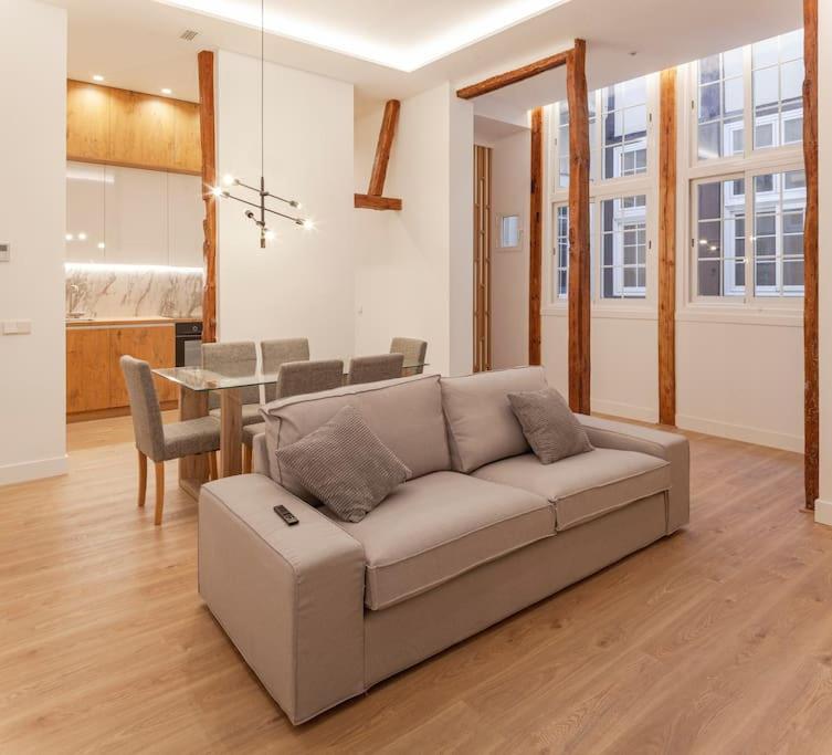 a living room with a couch and a table at Luxury flat Centro I in Madrid