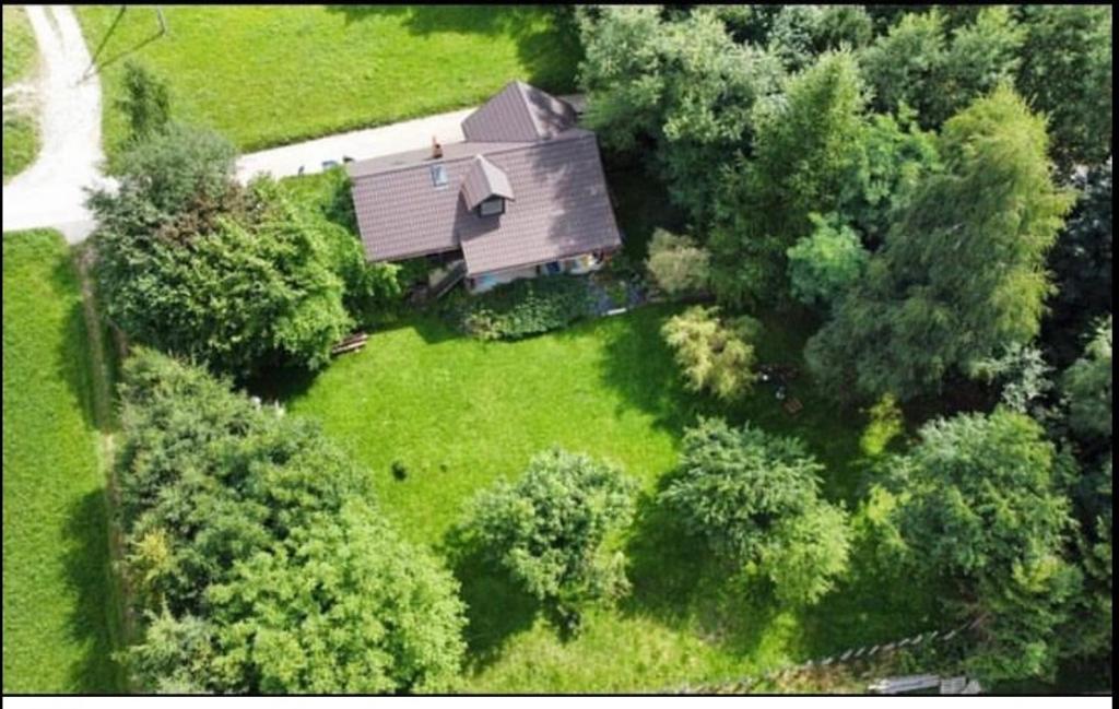 an overhead view of a house in a field with trees at Chatka Koniaków 7 in Koniaków