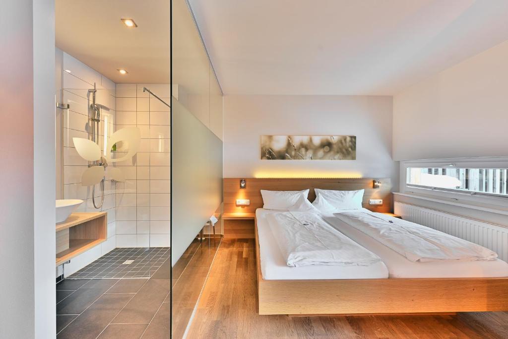 Krevet ili kreveti u jedinici u okviru objekta Genuss- & Aktivhotel Sonnenburg