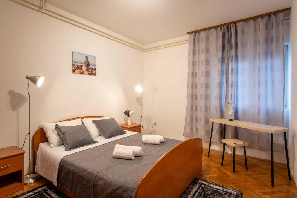 Postel nebo postele na pokoji v ubytování Oštarić