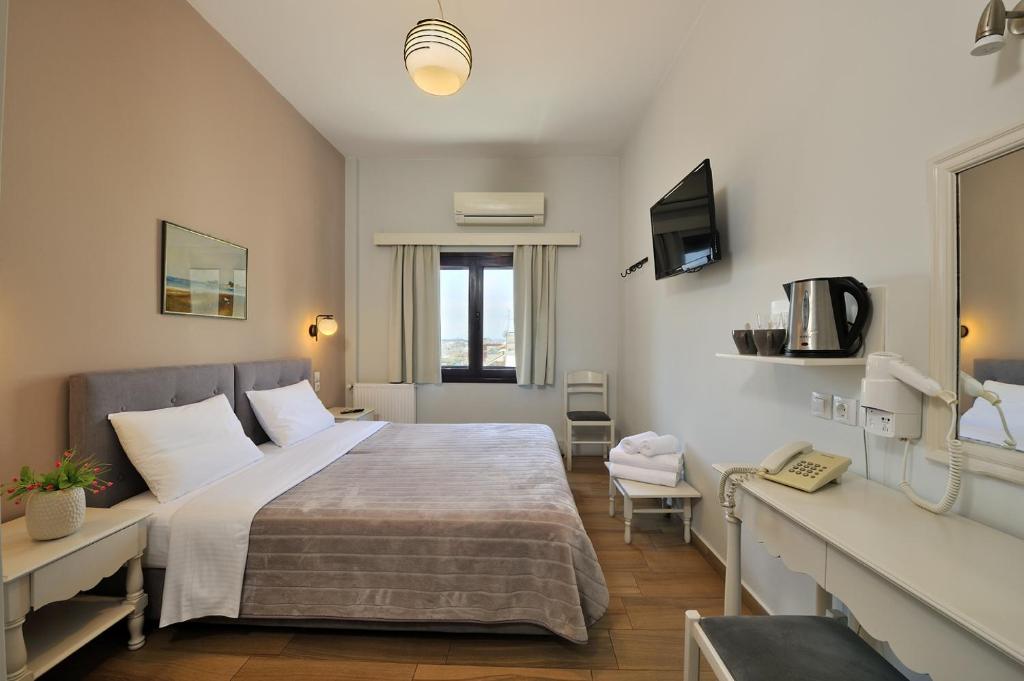 Posteľ alebo postele v izbe v ubytovaní Dryades & Orion Hotel
