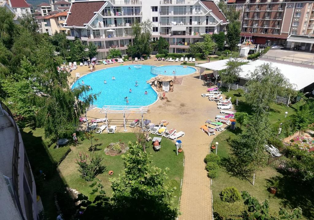 a large swimming pool with people in a resort at Kims One-bed Apart for rent at Sunny Beach Resort in Sunny Beach