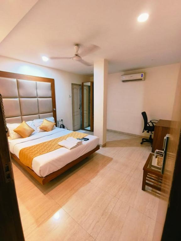Postel nebo postele na pokoji v ubytování Apex Hotel