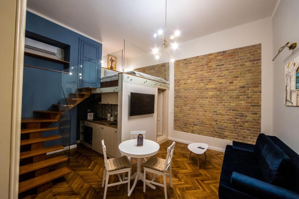 TV a/nebo společenská místnost v ubytování VISAJ Deluxe Downtown