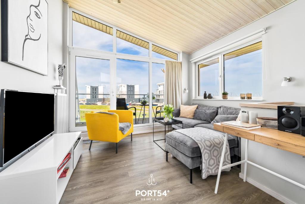 TV a/nebo společenská místnost v ubytování Ferienhaus Kleine Sonne Marina Wendtorf