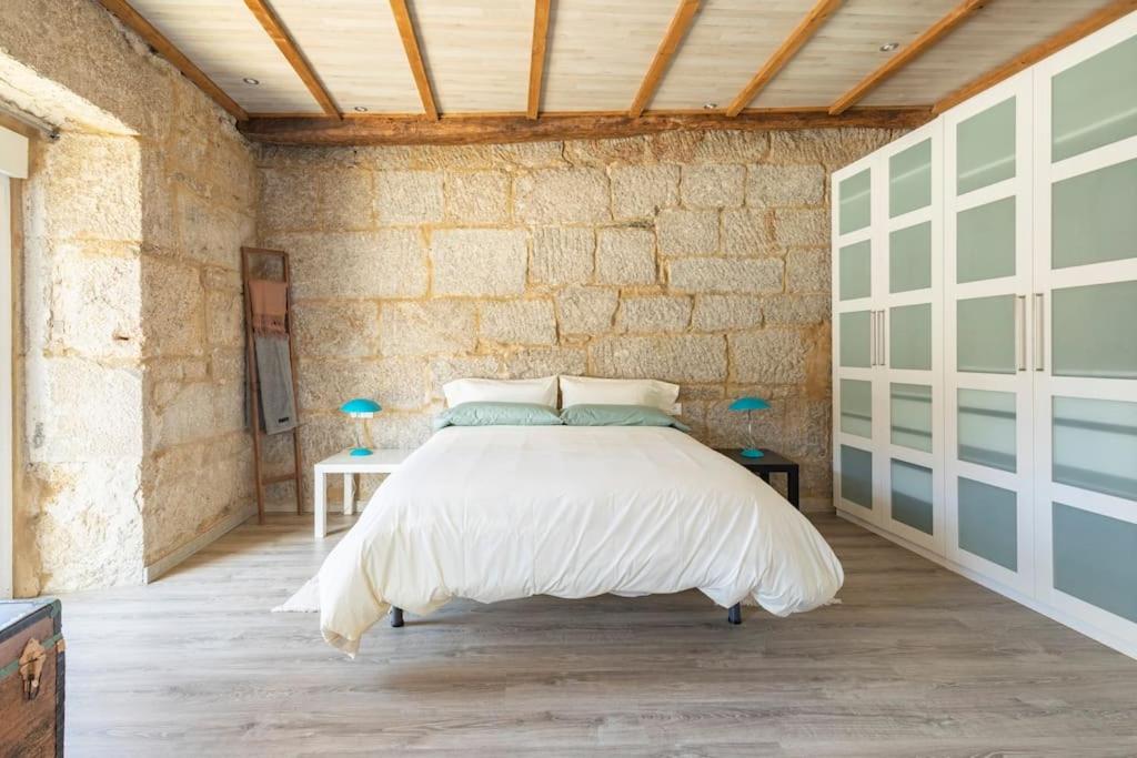 Säng eller sängar i ett rum på Casa en Dozón Centro de Galicia