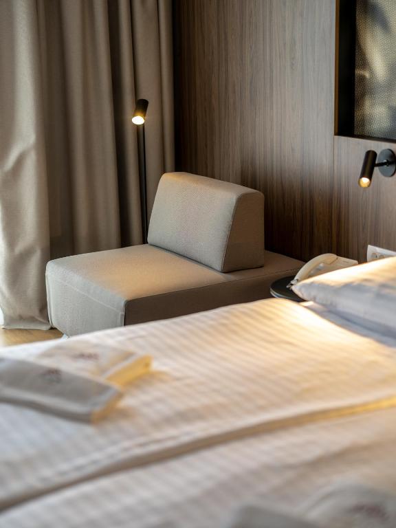 Postel nebo postele na pokoji v ubytování Hotel Villa Rosetta