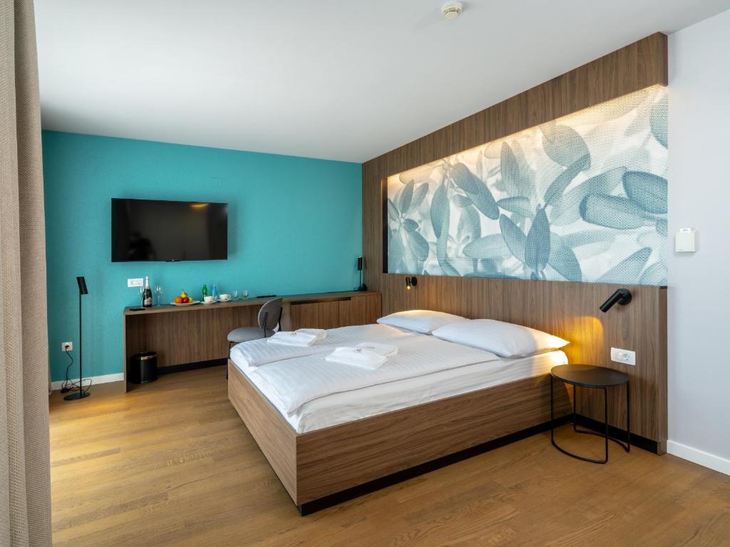 Postel nebo postele na pokoji v ubytování Hotel Villa Rosetta