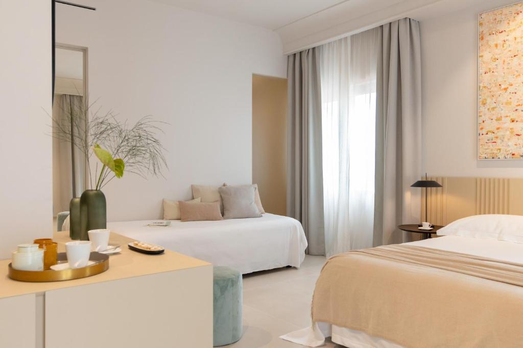 Postel nebo postele na pokoji v ubytování Taodomus Boutique Hotel