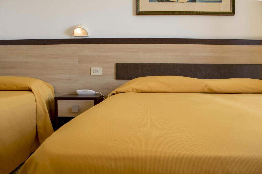 Postel nebo postele na pokoji v ubytování Hotel Apollonia