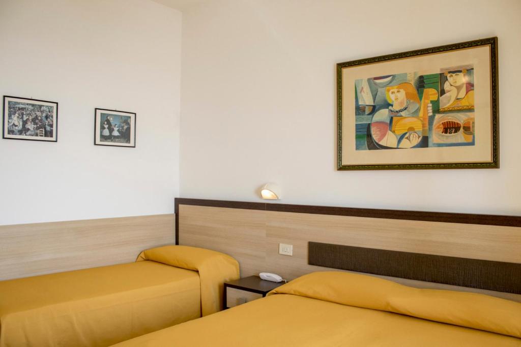 Postel nebo postele na pokoji v ubytování Hotel Apollonia