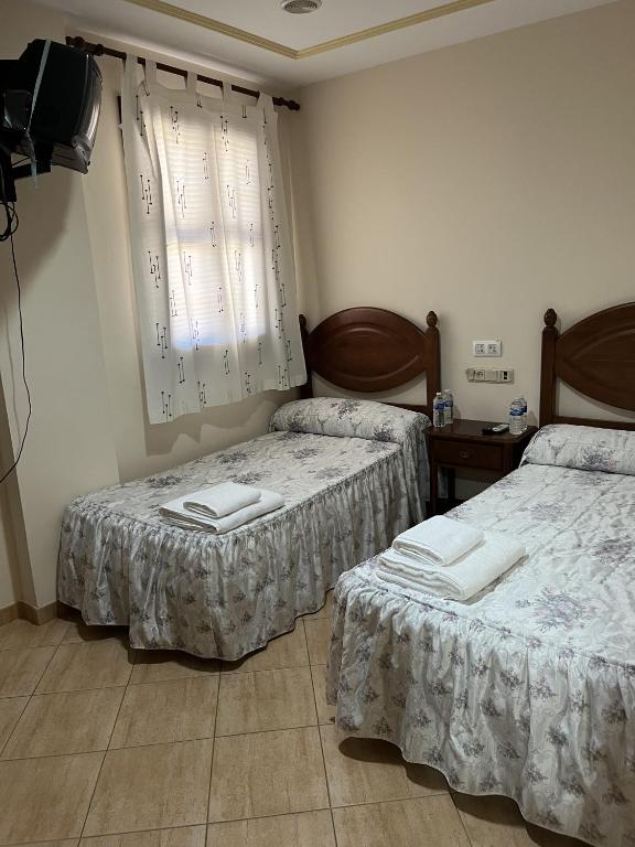 Postel nebo postele na pokoji v ubytování El Carmen